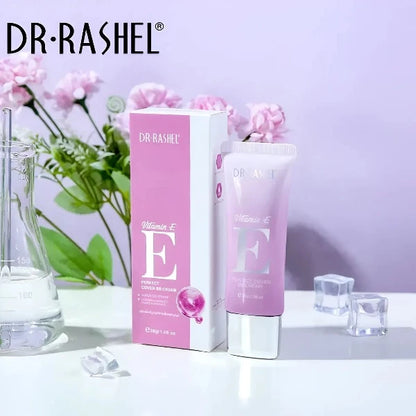 Box and tube of Dr. Rashel's Vitamin E Perfect Cover BB Cream set in a makeup kit with flowers in the background.